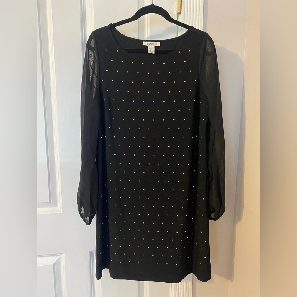 Little black dress with gold embellishments and sheer sleeves